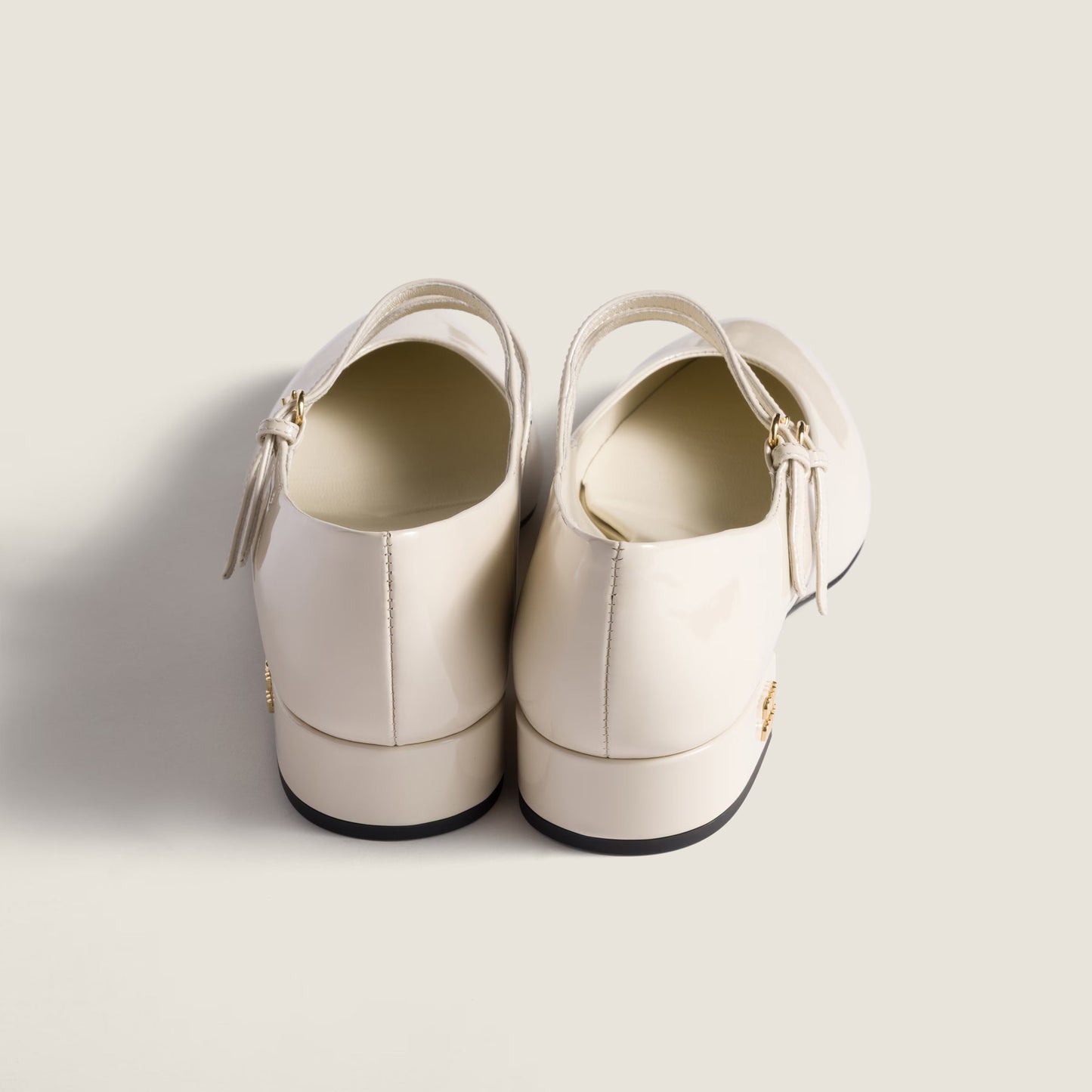 Patent-leather slingback court shoes with buckles