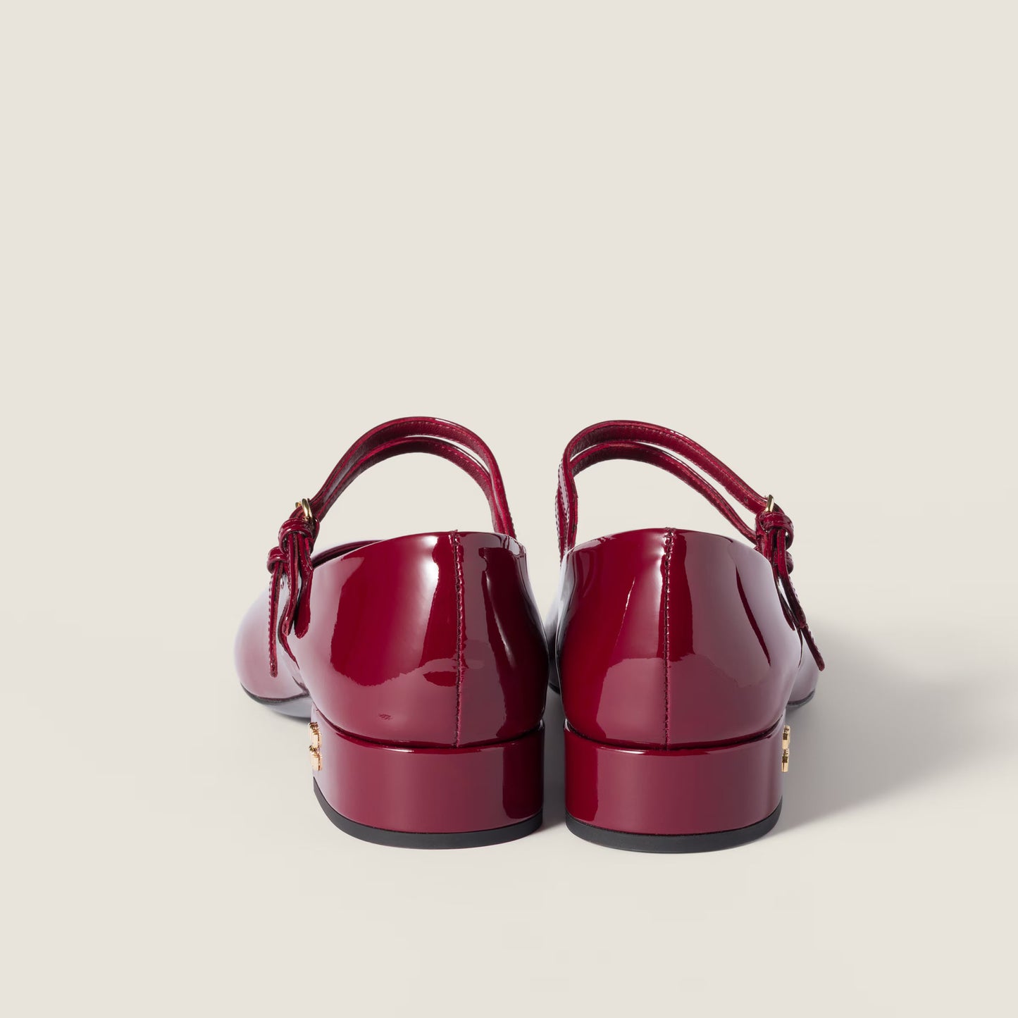 Patent-leather slingback court shoes with buckles