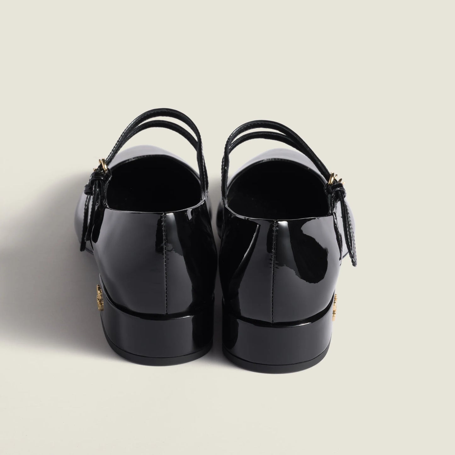 Patent-leather slingback court shoes with buckles